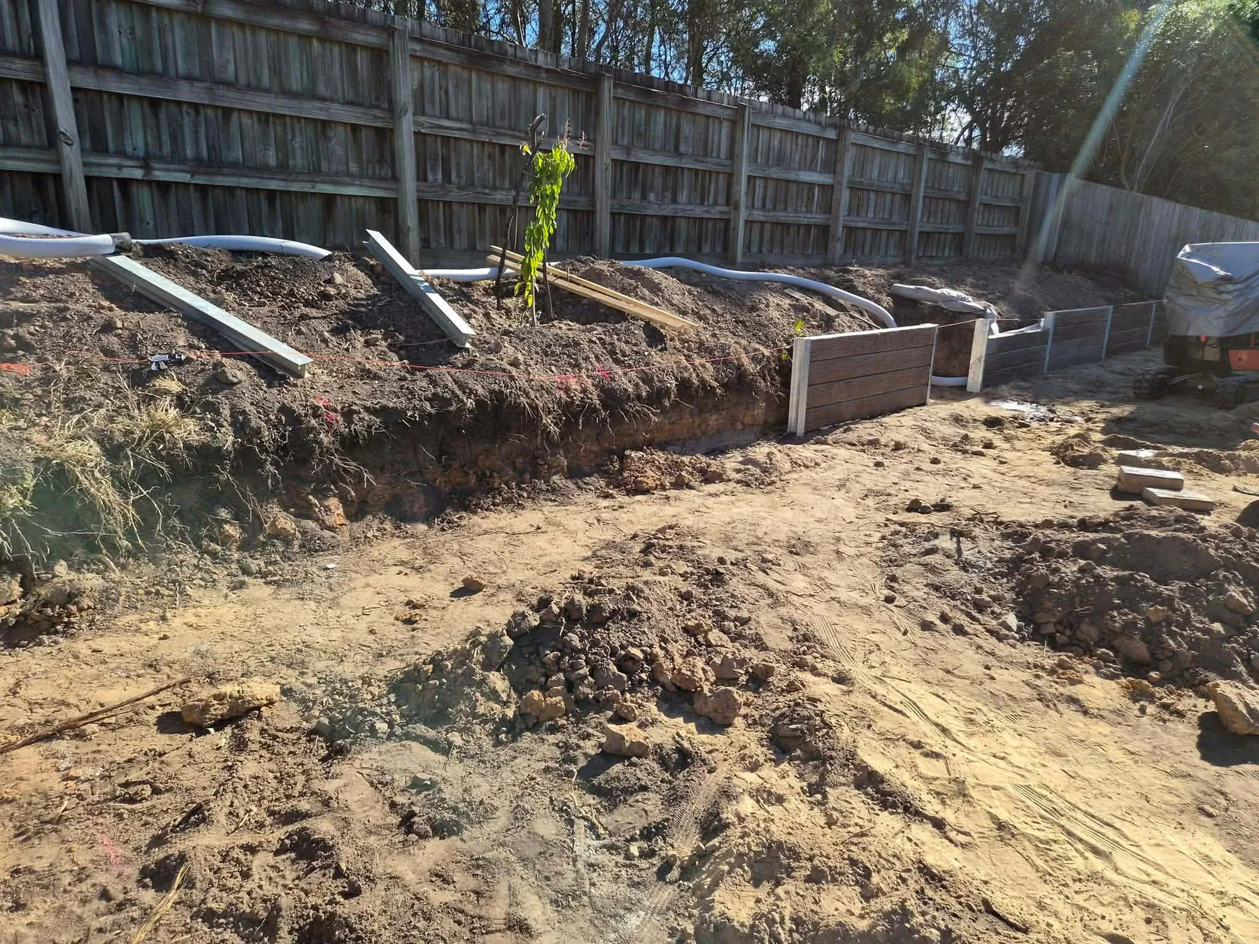 Retaining wall installation in progress